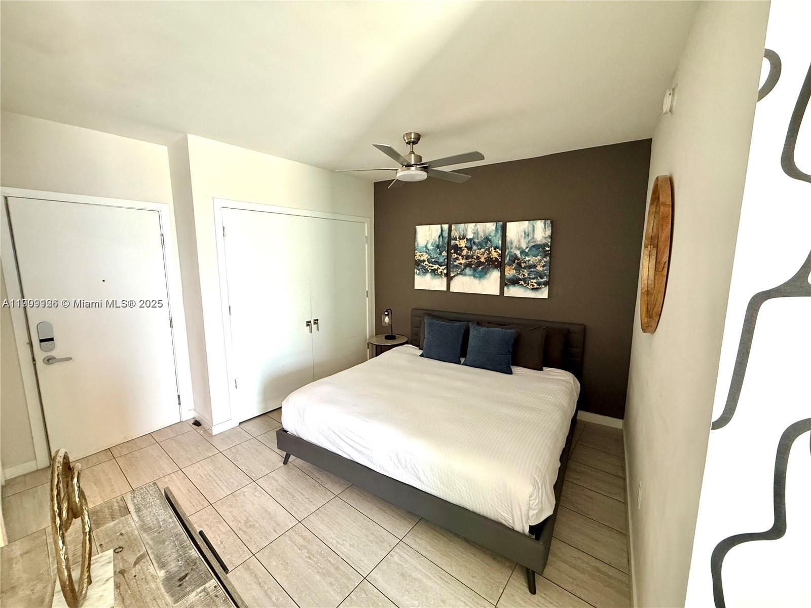 3900 Biscayne Boulevard, Unit N723 Miami, FL 33137 - Photo 19 of 30 a bedroom with a bed and a window