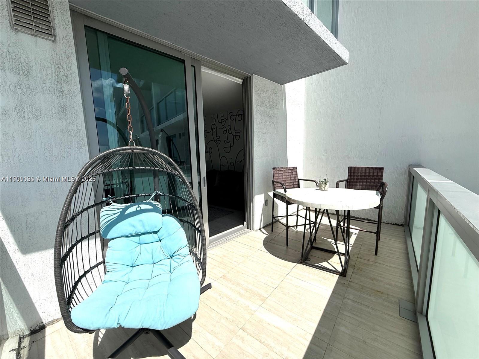 3900 Biscayne Boulevard, Unit N723 Miami, FL 33137 - Photo 20 of 30 a bedroom with a bed and a mirror