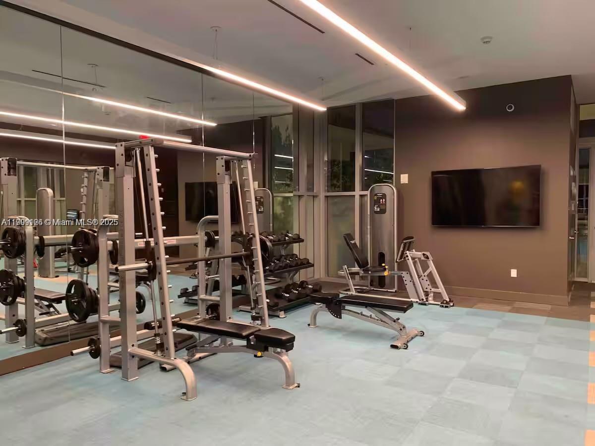 3900 Biscayne Boulevard, Unit N723 Miami, FL 33137 - Photo 27 of 30 a view of a room with gym equipment