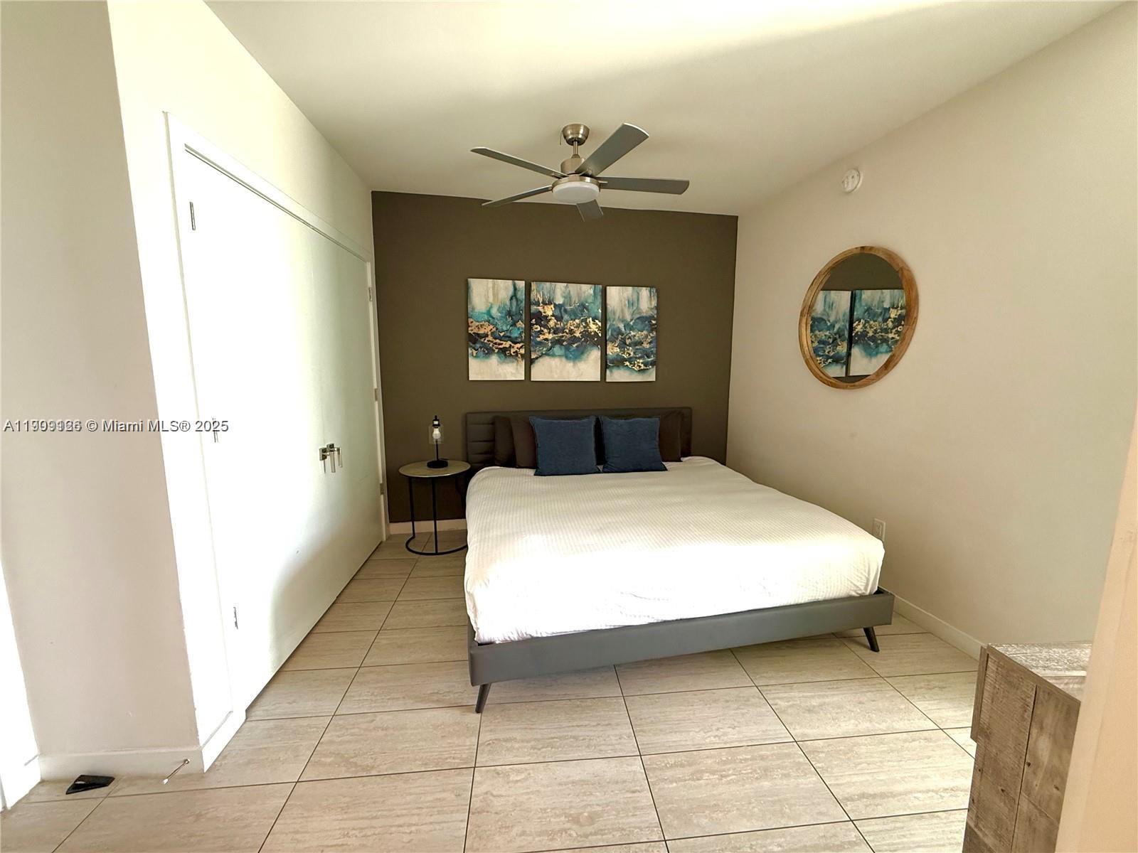 3900 Biscayne Boulevard, Unit N723 Miami, FL 33137 - Photo 30 of 30 a bedroom with a bed and a window