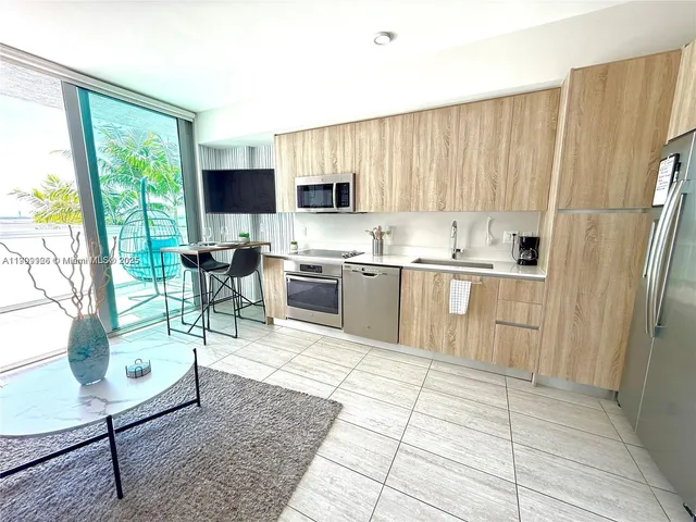 a living room with furniture and a white door