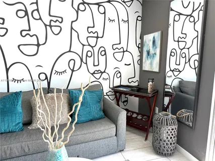 a living room with furniture and a white door