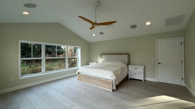 a bed room with a bed furniture and a window