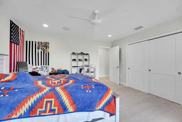 a bathroom with a toilet sink shower and view