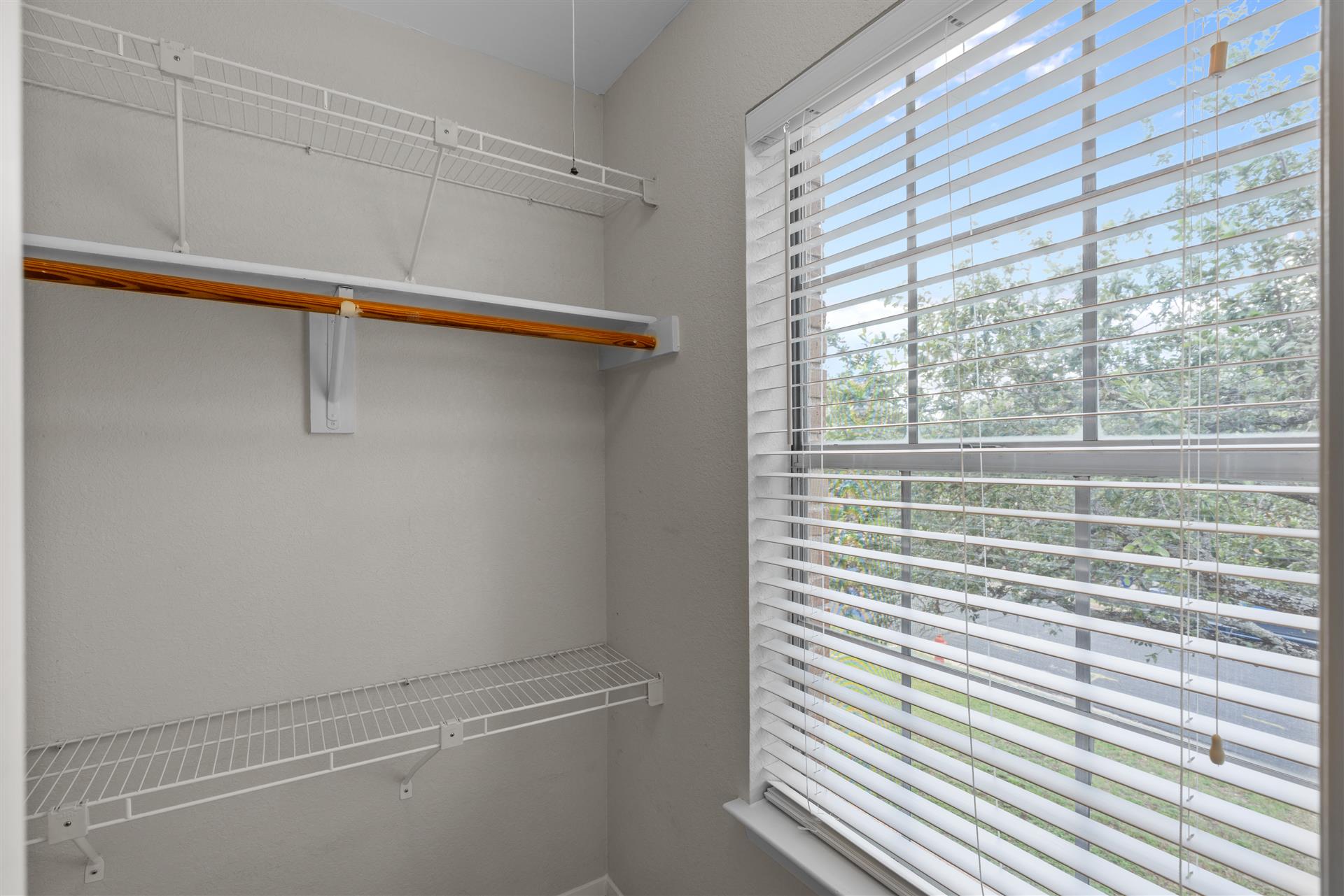 1710 Persimmon Road Cedar Park, TX 78613 - Photo 28 of 33 Secondary bedroom #2 walk-in closet with ample storage solutions abound in this bright closet, complete with organized shelving.