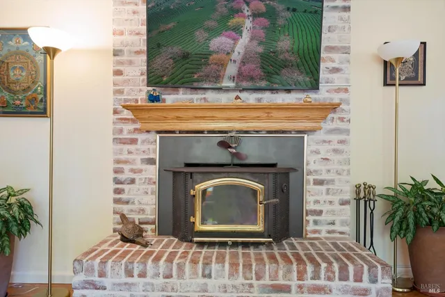 a view of a dining room with furniture a chandelier and wooden floor