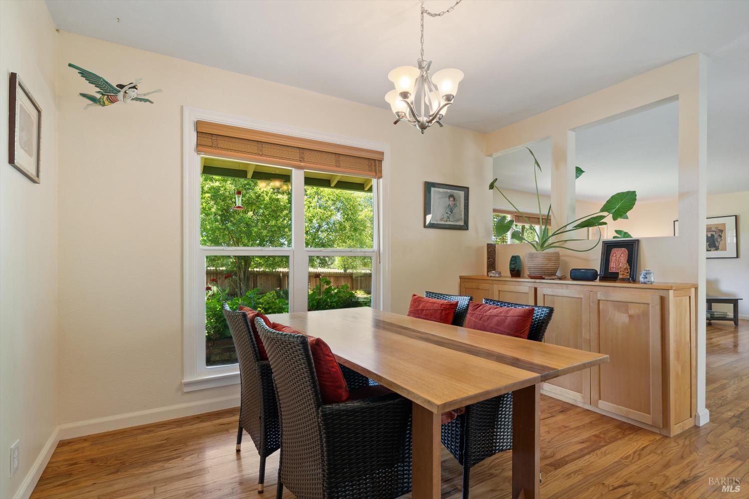 644 Piezzi Road Santa Rosa, CA 95401 - Photo 12 of 63 a view of a dining room with furniture a chandelier and wooden floor