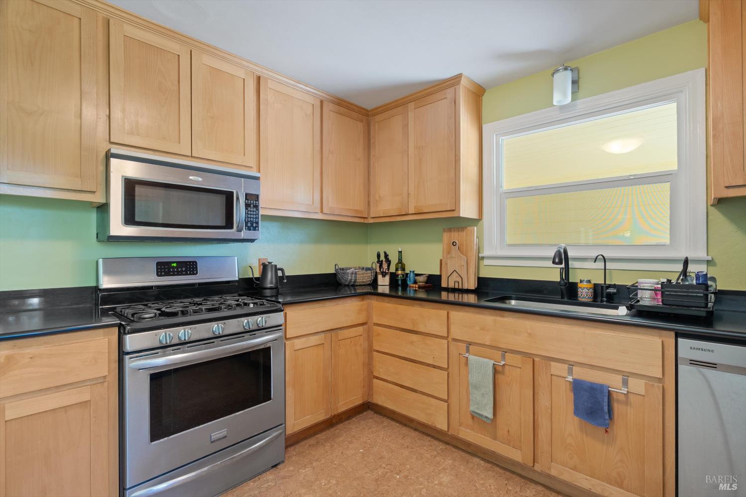 644 Piezzi Road Santa Rosa, CA 95401 - Photo 14 of 63 a kitchen with granite countertop white cabinets sink and stainless steel appliances