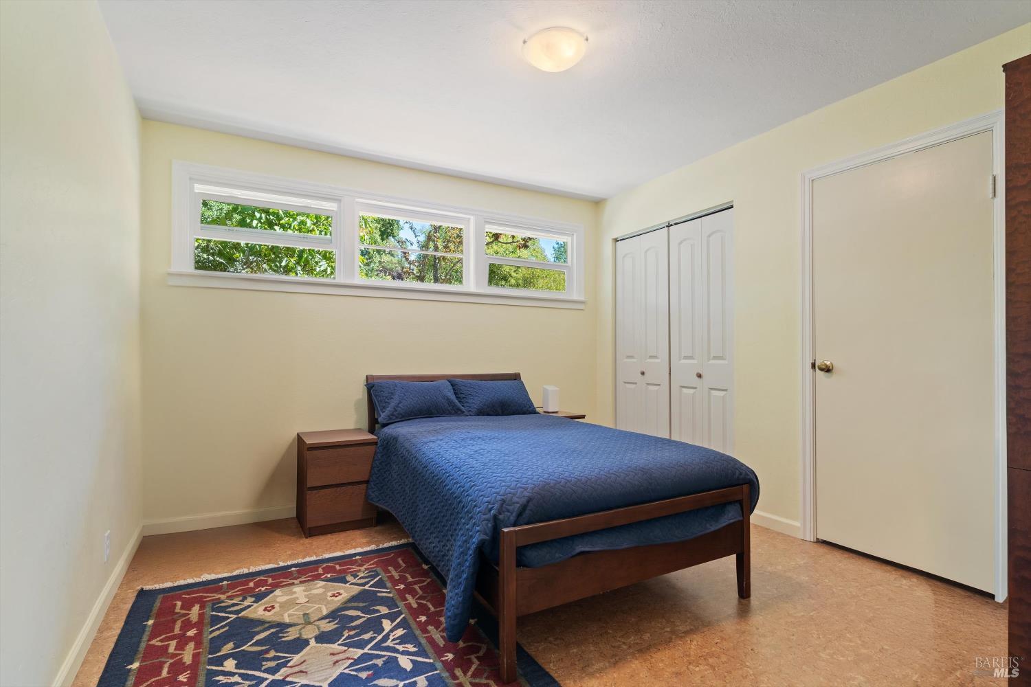 644 Piezzi Road Santa Rosa, CA 95401 - Photo 16 of 63 a bedroom with a bed and a table