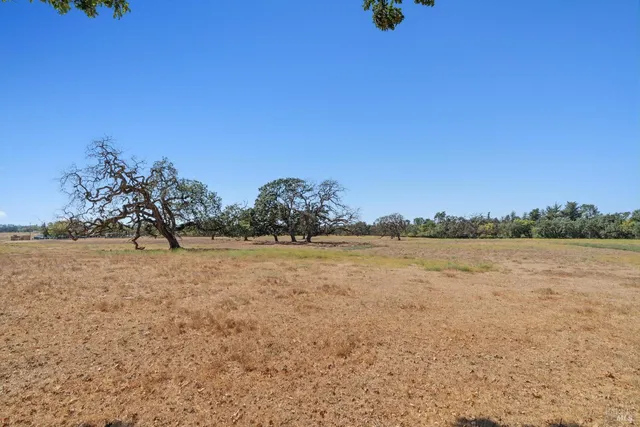 an aerial view of residential houses and outdoor space