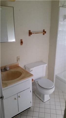 3248 Anderson Road Antioch, TN 37013 - Photo 11 of 17 a bathroom with a granite countertop toilet and a sink