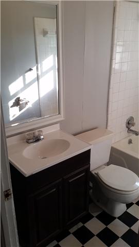 3248 Anderson Road Antioch, TN 37013 - Photo 5 of 17 a bathroom with a sink a toilet a mirror and vanity