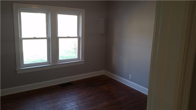 3248 Anderson Road Antioch, TN 37013 - Photo 7 of 17 an empty room with wooden floor and windows