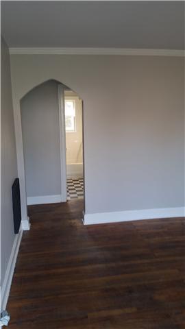 3248 Anderson Road Antioch, TN 37013 - Photo 8 of 17 a view of an empty room with wooden floor and a window