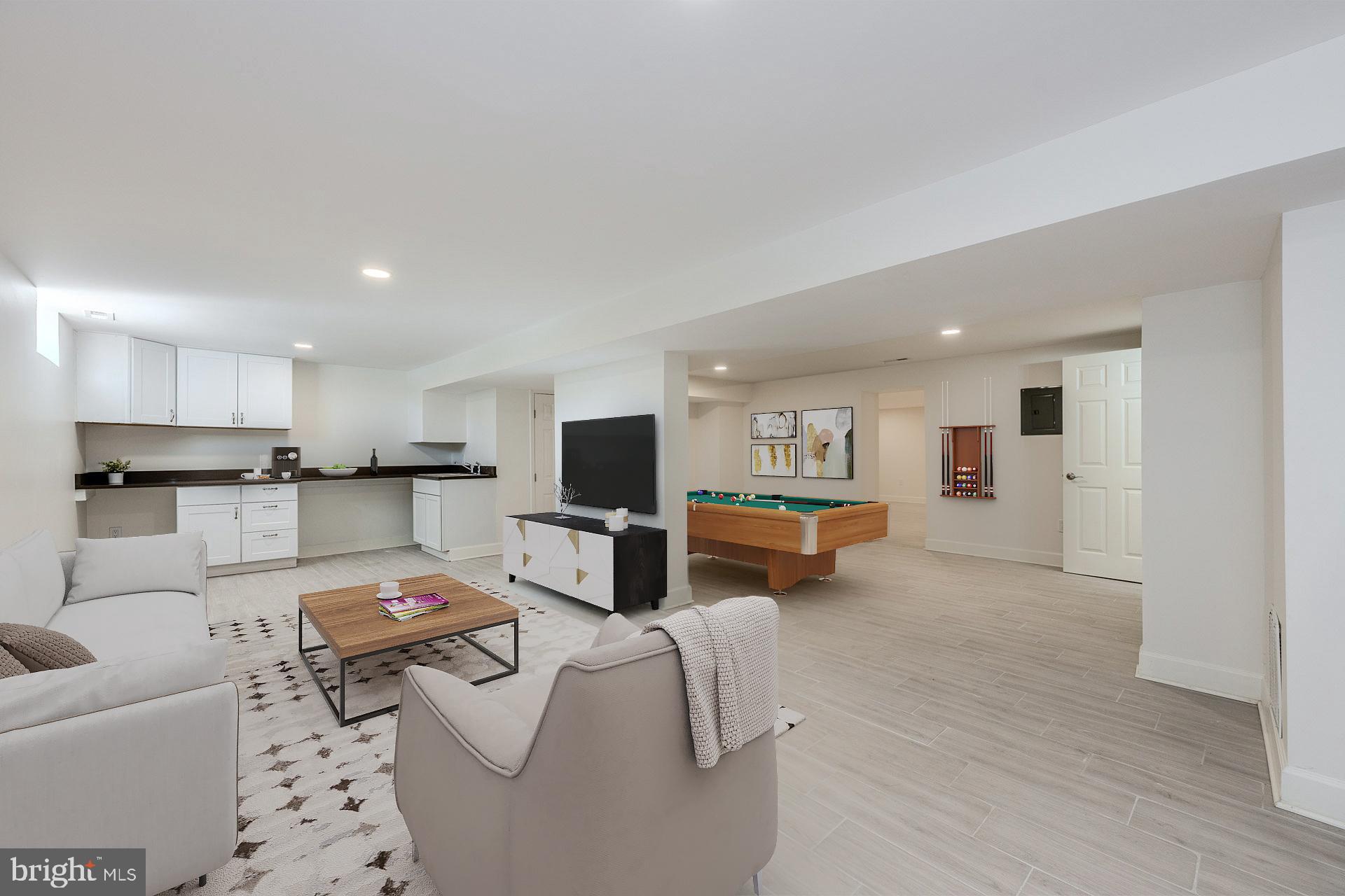 12300 Braddock Road Fairfax, VA 22030 - Photo 13 of 70 a living room with furniture and a flat screen tv