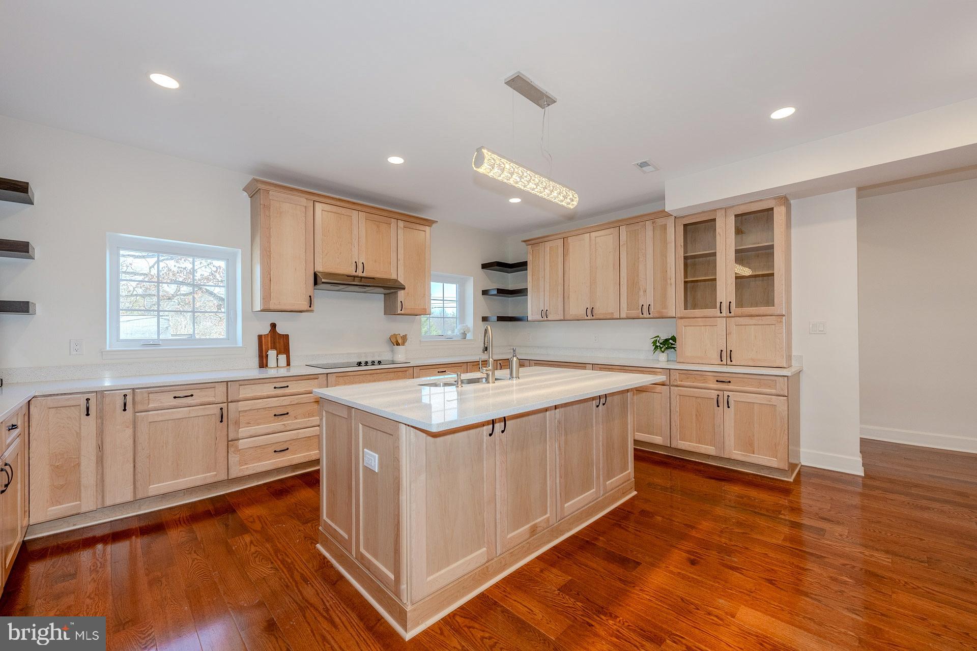 12300 Braddock Road Fairfax, VA 22030 - Photo 21 of 70 a kitchen with stainless steel appliances granite countertop a stove and a sink