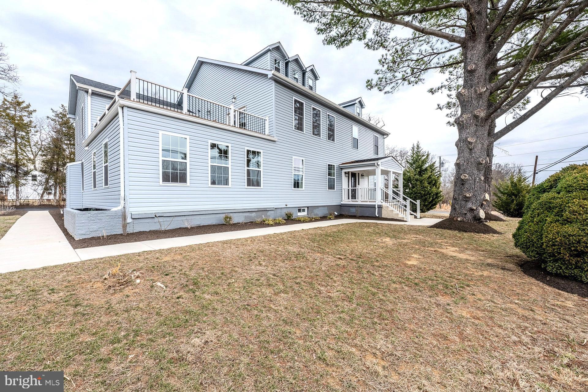 12300 Braddock Road Fairfax, VA 22030 - Photo 3 of 70 a house that has a tree in front of it