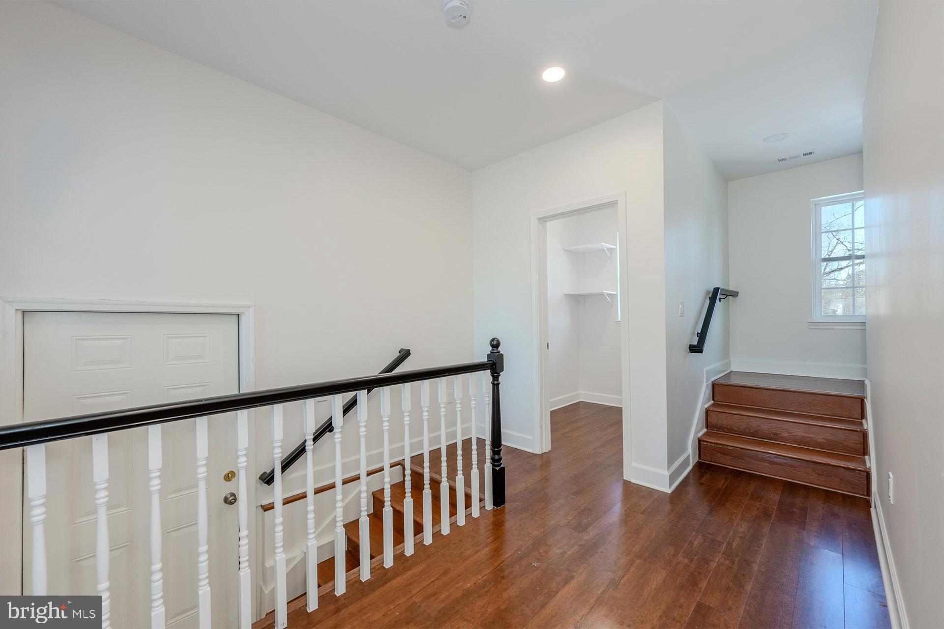 12300 Braddock Road Fairfax, VA 22030 - Photo 31 of 70 a view of entryway with wooden floor and stairs