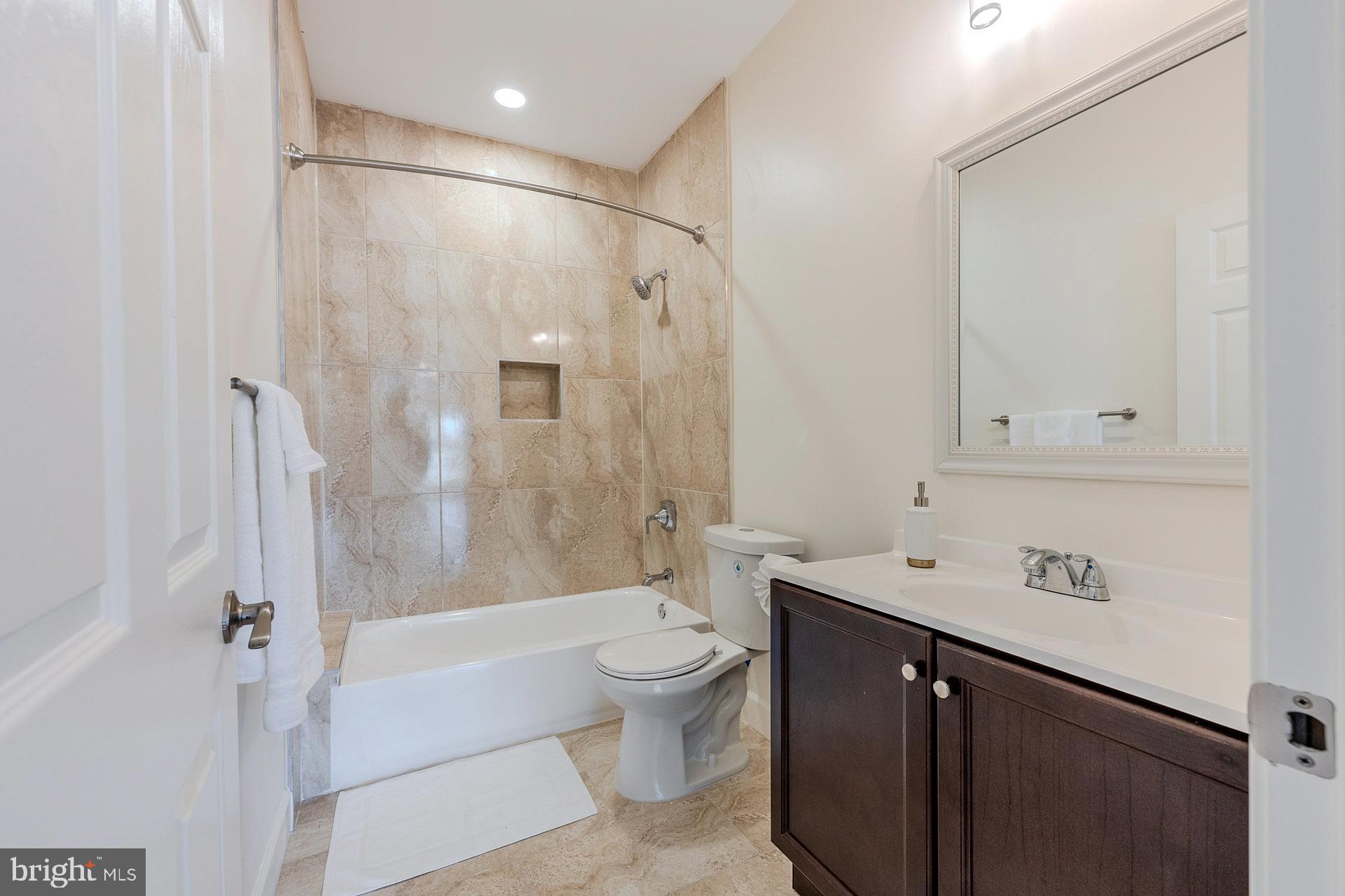 12300 Braddock Road Fairfax, VA 22030 - Photo 36 of 70 a bathroom with a sink a toilet and shower