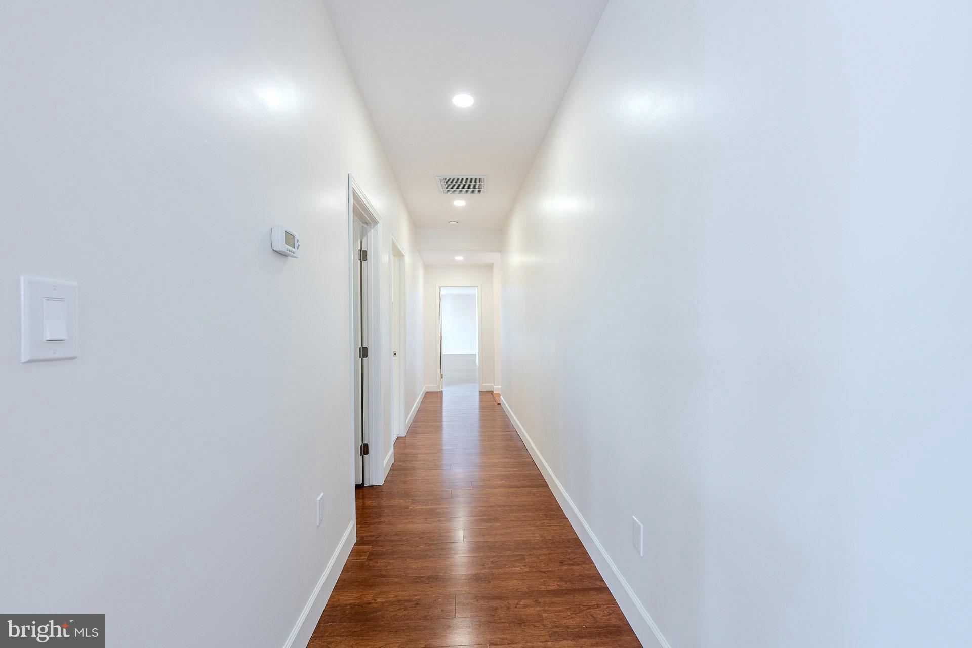 12300 Braddock Road Fairfax, VA 22030 - Photo 39 of 70 a view of a hallway with wooden floor