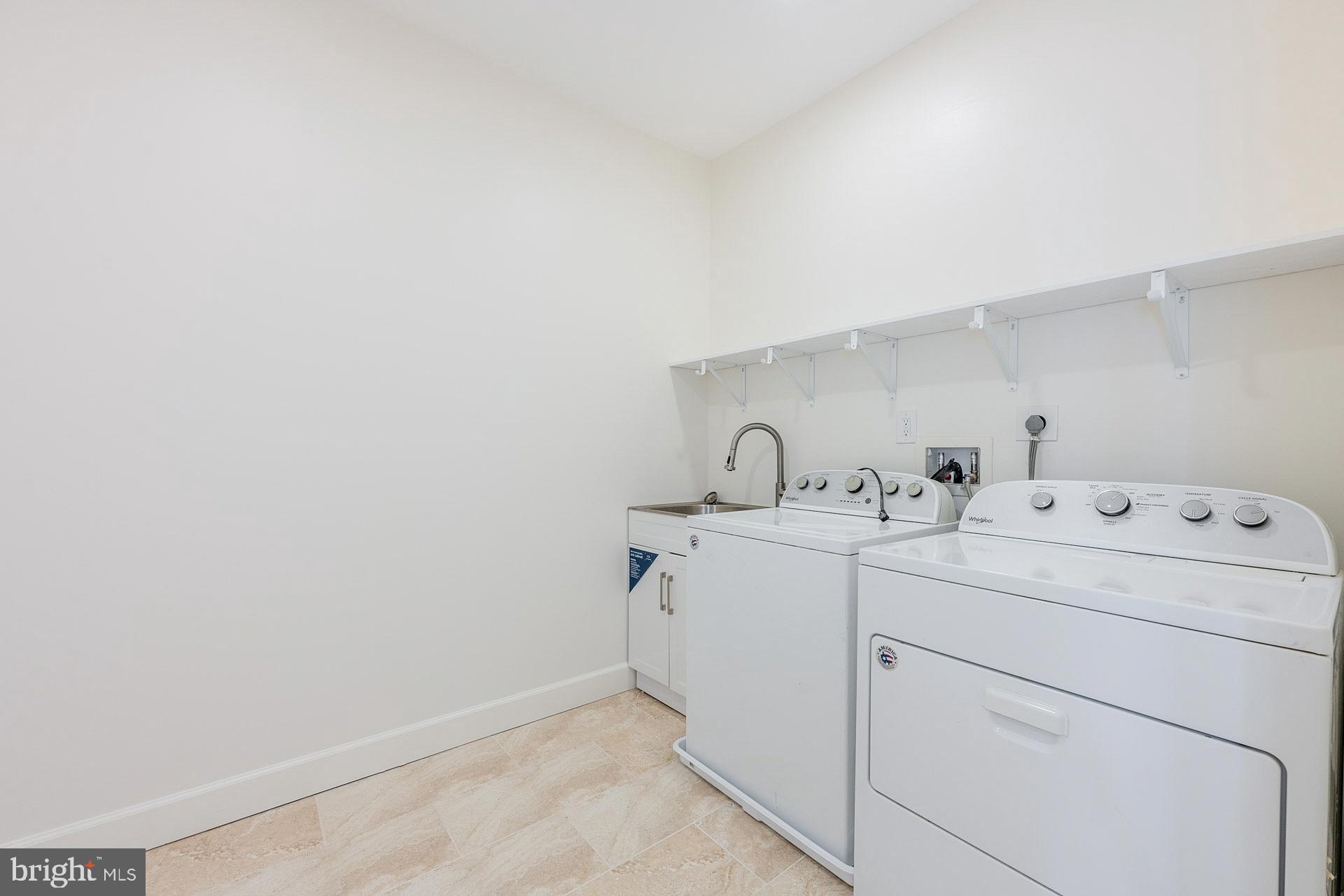 12300 Braddock Road Fairfax, VA 22030 - Photo 46 of 70 a utility room with dryer and washer