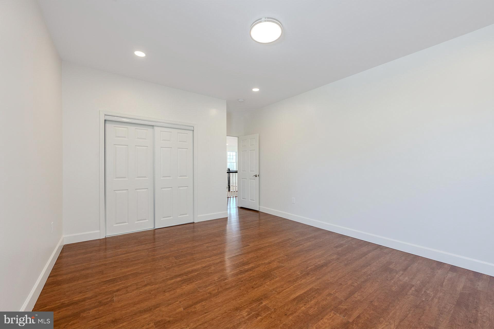 12300 Braddock Road Fairfax, VA 22030 - Photo 48 of 70 a view of an empty room with wooden floor