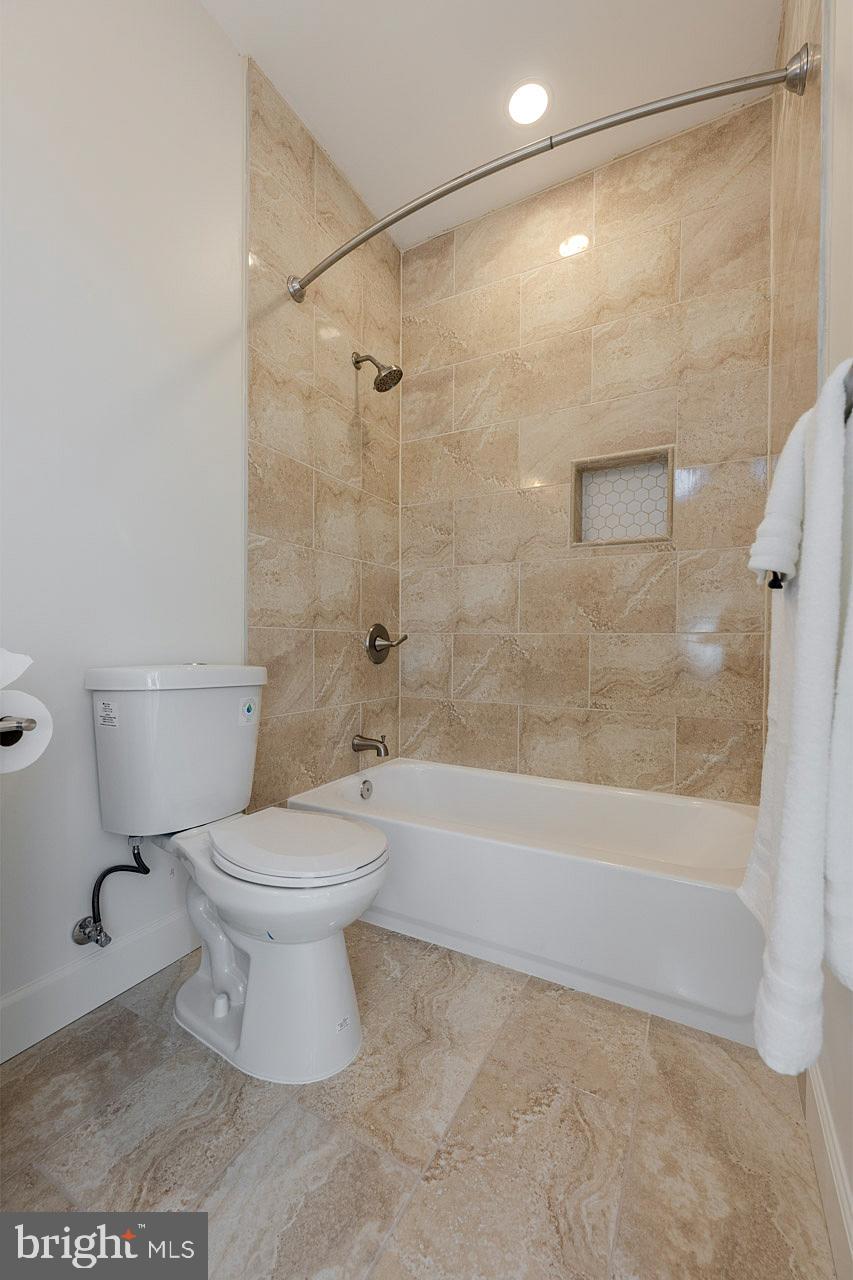 12300 Braddock Road Fairfax, VA 22030 - Photo 58 of 70 a bathroom with a toilet and a shower