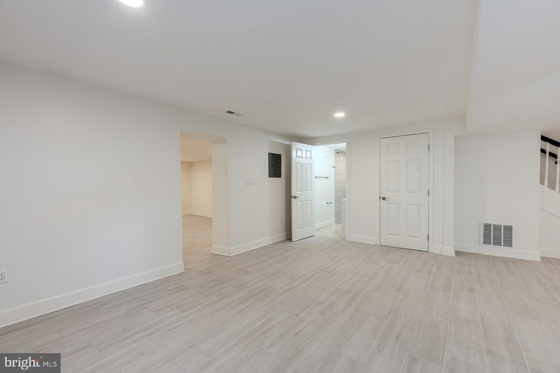 12300 Braddock Road Fairfax, VA 22030 - Photo 60 of 70 a view of an empty room with wooden floor