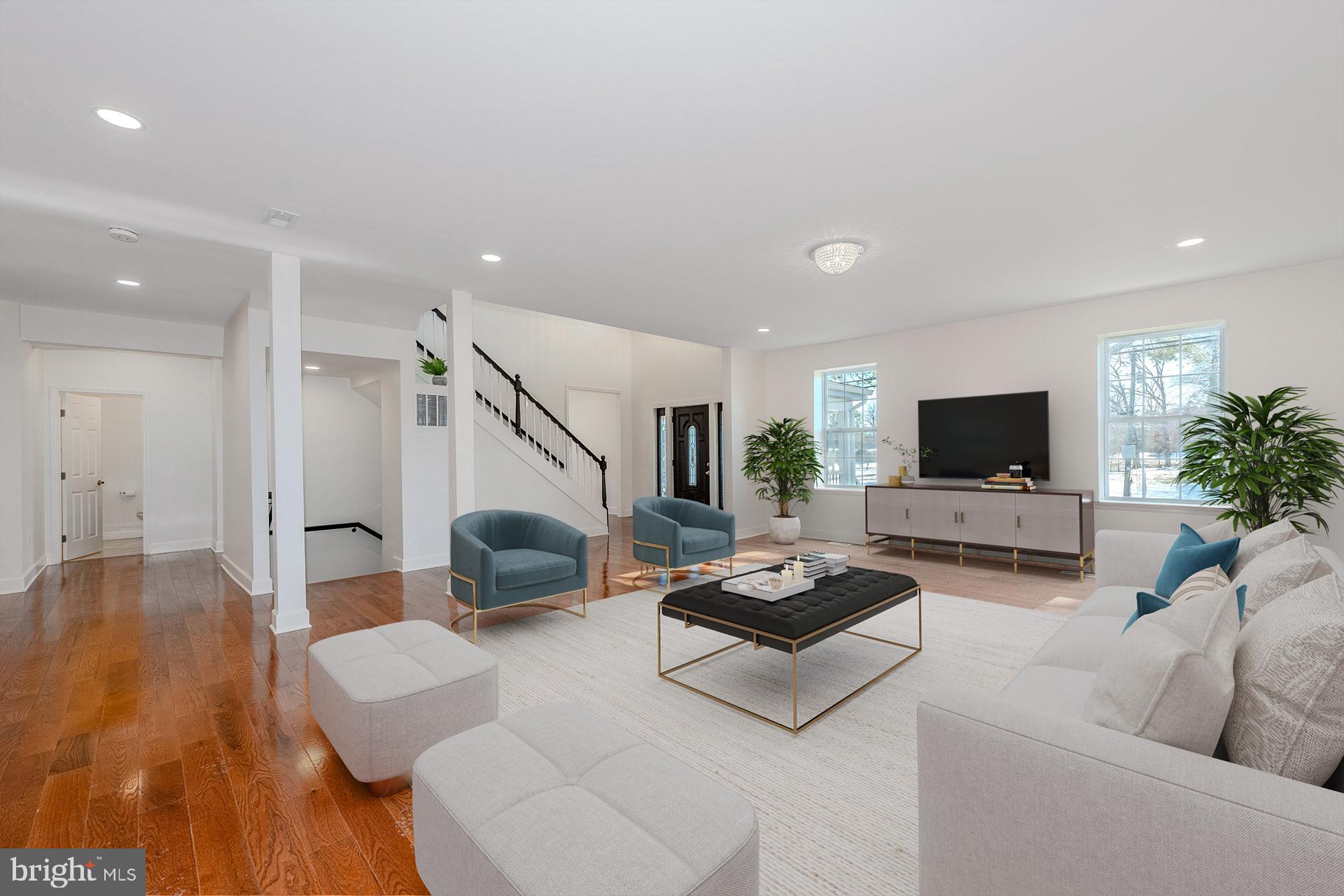 12300 Braddock Road Fairfax, VA 22030 - Photo 6 of 70 a living room with furniture and a flat screen tv