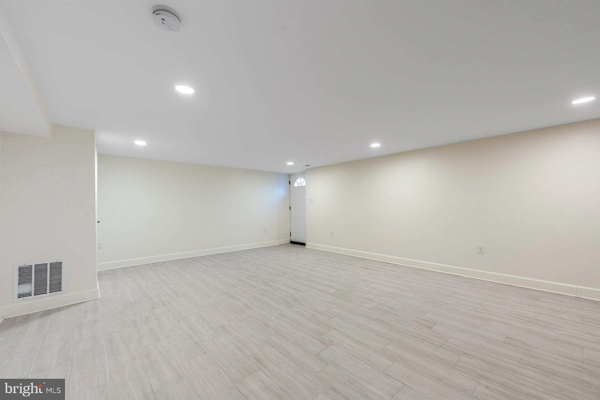12300 Braddock Road Fairfax, VA 22030 - Photo 62 of 70 an empty room with wooden floor and windows