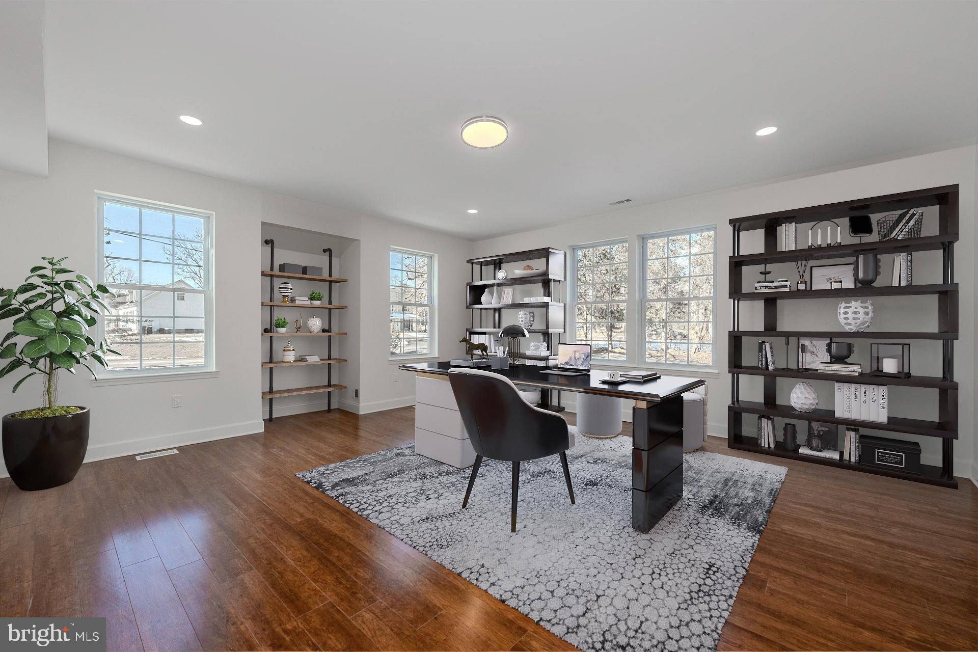 12300 Braddock Road Fairfax, VA 22030 - Photo 10 of 70 a living room with furniture and a book shelf