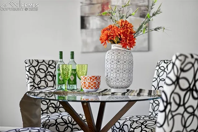 a kitchen with a sink cabinets a wooden floor and a window