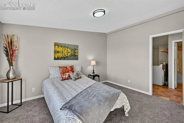 a spacious bathroom with a toilet sink and mirror
