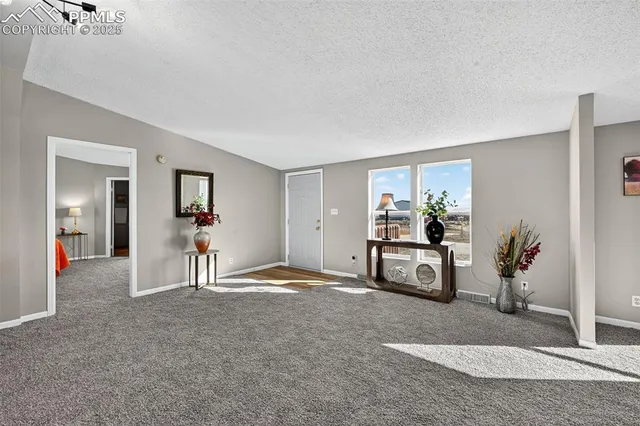 a bedroom with furniture and a chair