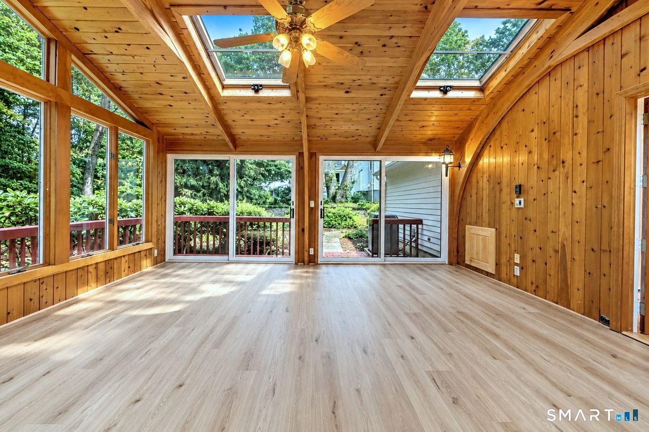 185 Nepas Road Fairfield, CT 06825 - Photo 13 of 38 VIEWS FROM EVERY ANGLE AND TWO SETS OF SLIDERS ON EACH SIDE TO ACCESS THE EXTERIOR AND FRENCH DOORS TO ACCESS THE INTERIOR FAMILY ROOM.