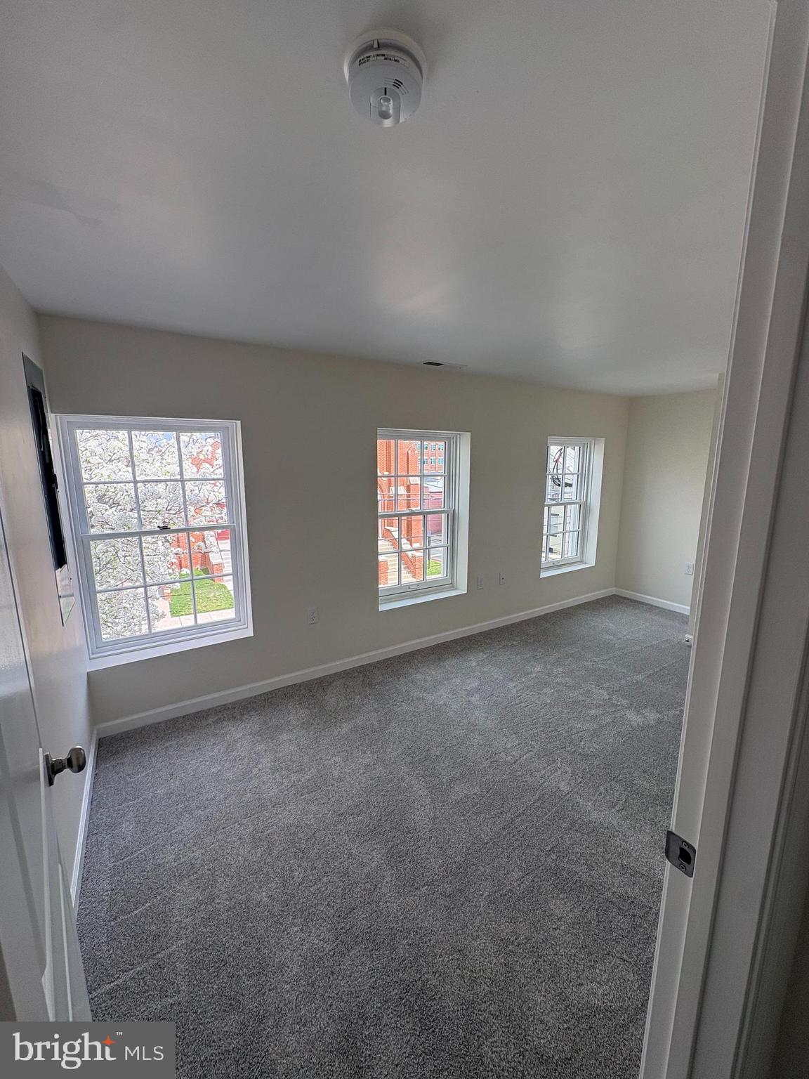 104 West All Saints Street, Unit C2 Frederick, MD 21701 - Photo 13 of 19 an empty room with windows