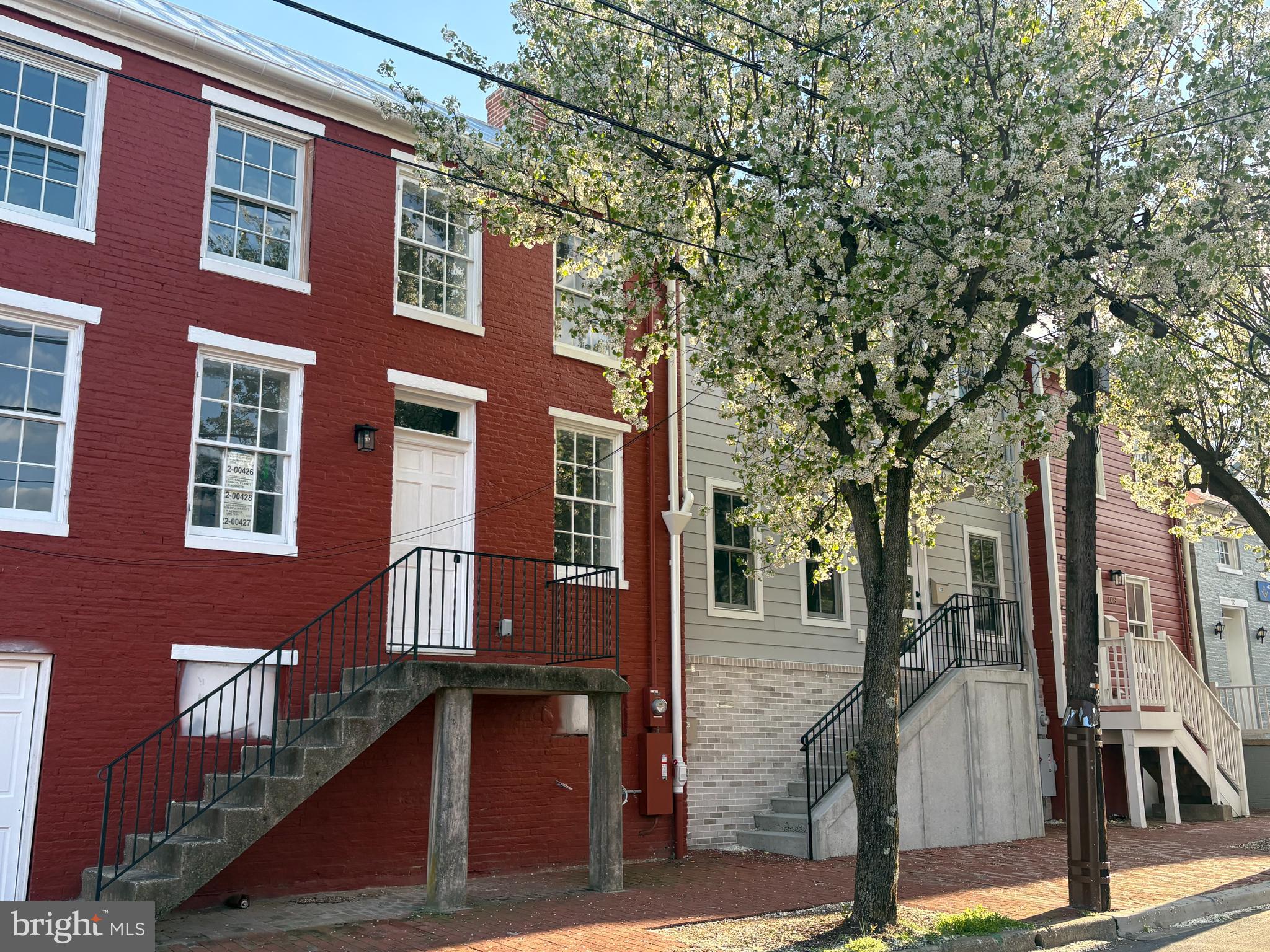 104 West All Saints Street, Unit C2 Frederick, MD 21701 - Photo 4 of 19 a front view of a building with a tree