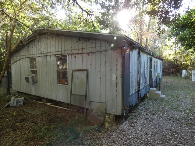 a backyard of a house with lots of green space