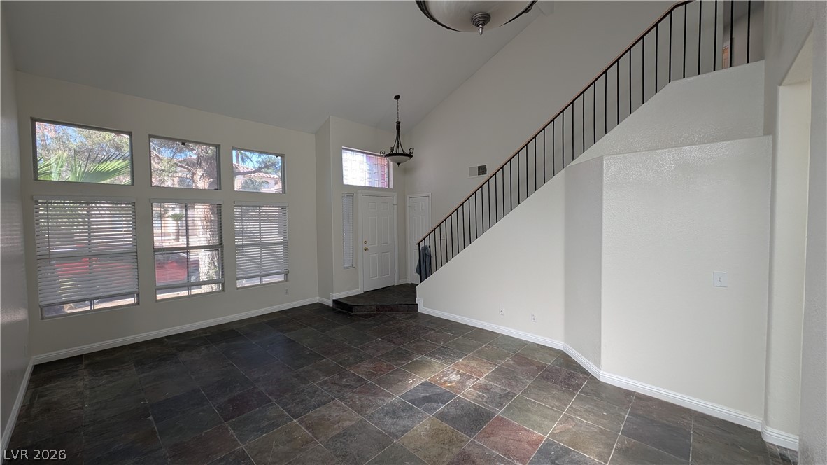 2670 Ridgewater Circle Henderson, NV 89074 - Photo 3 of 22 This bright entry welcomes you with abundant natural light and a flowing staircase.