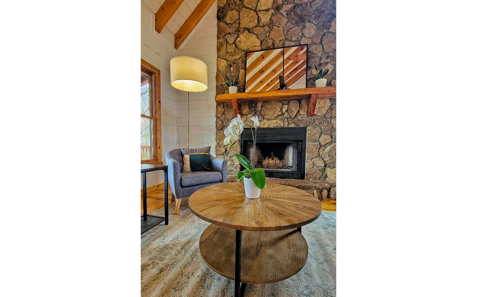 360 Tall Timber Mountain Road Blue Ridge, GA 30513 - Photo 6 of 52 a living room with furniture and a fireplace