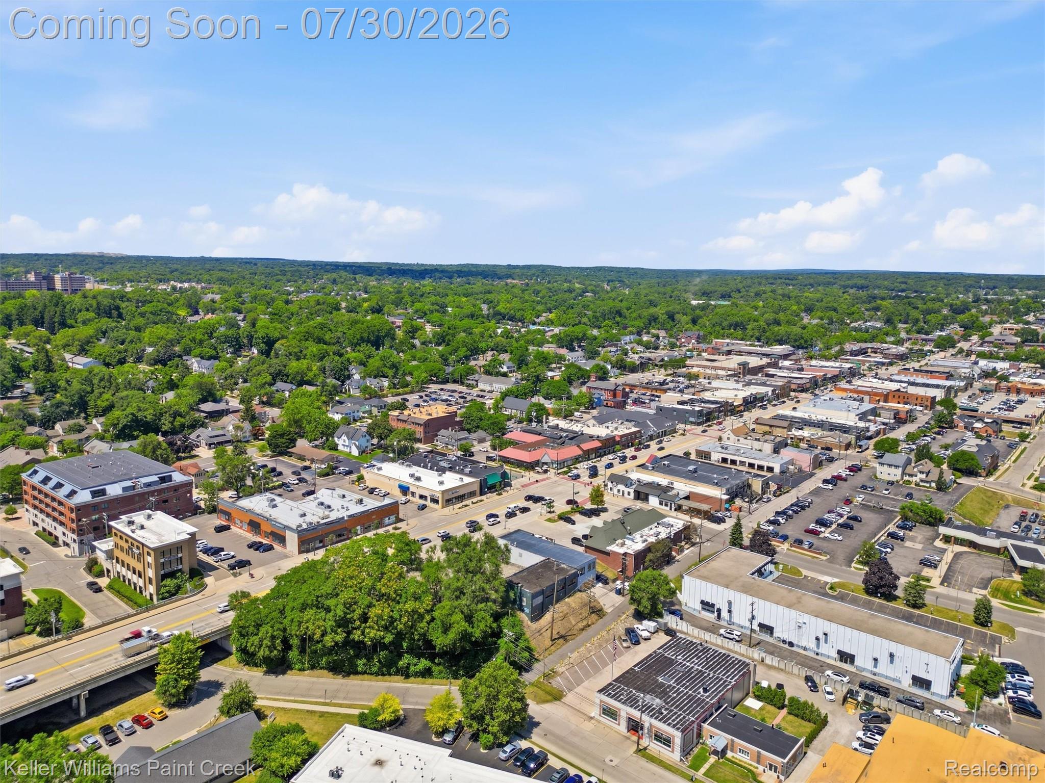 543 Arlington Drive Rochester, MI 48307 - Photo 55 of 59 Urban landscape featuring a mix of commercial buildings and residential areas