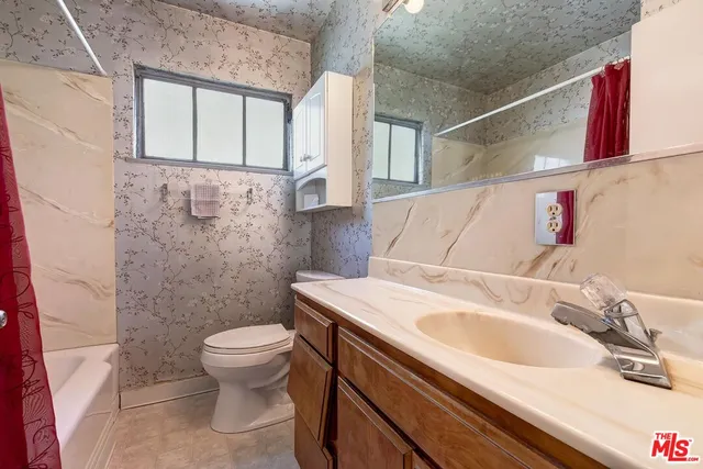 a bathroom with a sink and a toilet