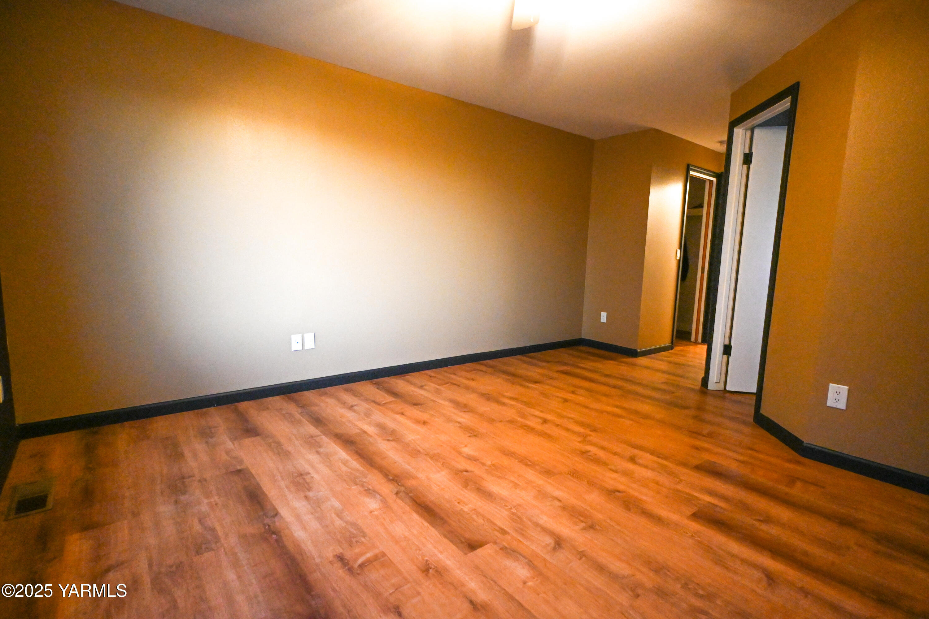 9621 Meadowbrook Road Yakima, WA 98903 - Photo 14 of 41 an empty room with wooden floor and windows