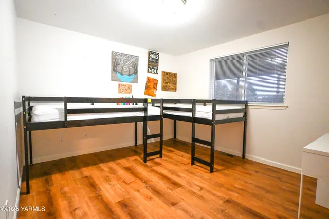 a view of a room with furniture and window