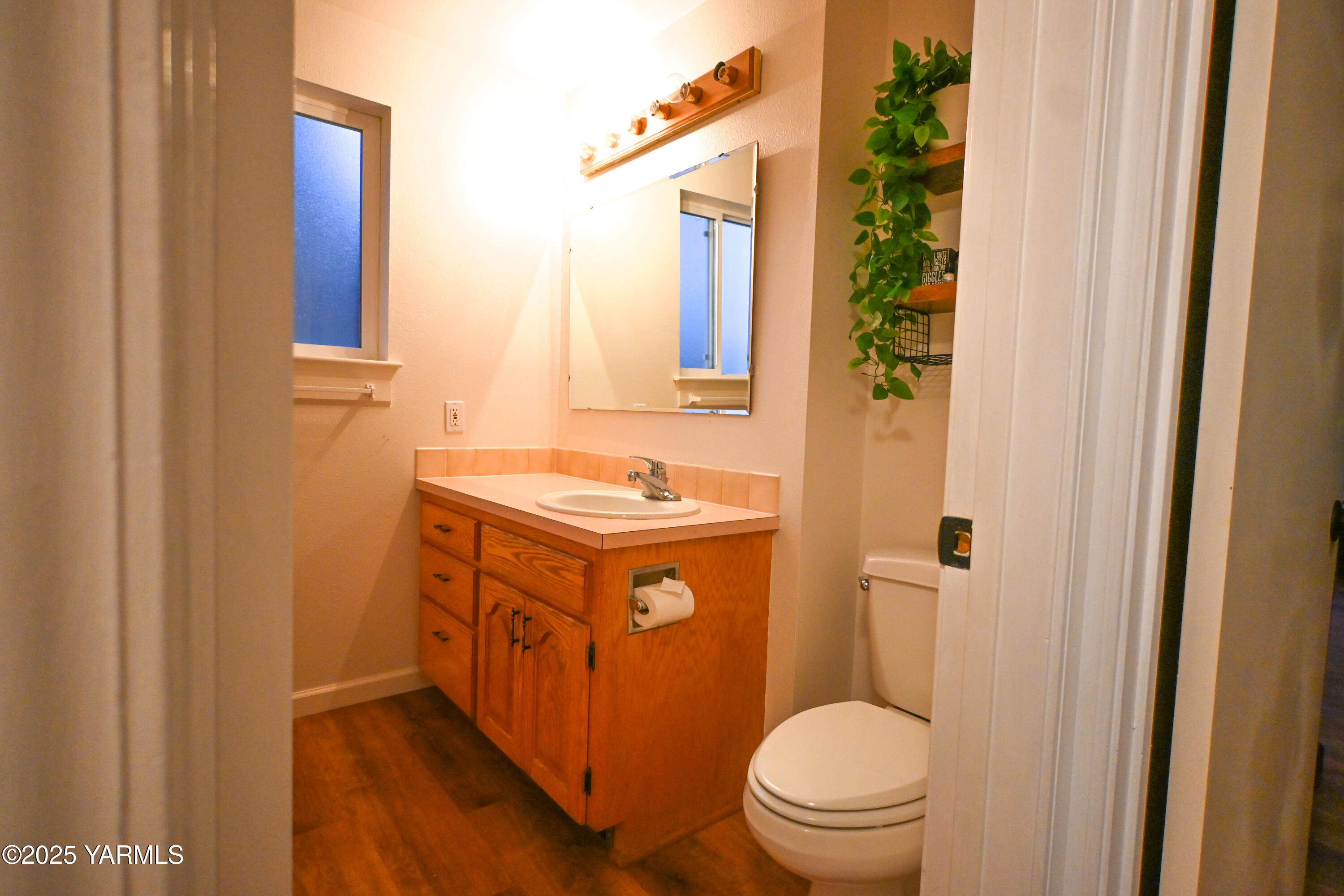 9621 Meadowbrook Road Yakima, WA 98903 - Photo 20 of 41 a bathroom with a granite countertop toilet sink and mirror