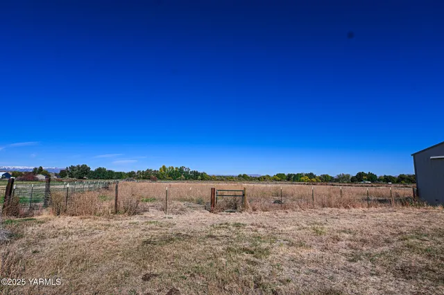 a house with trees in the background