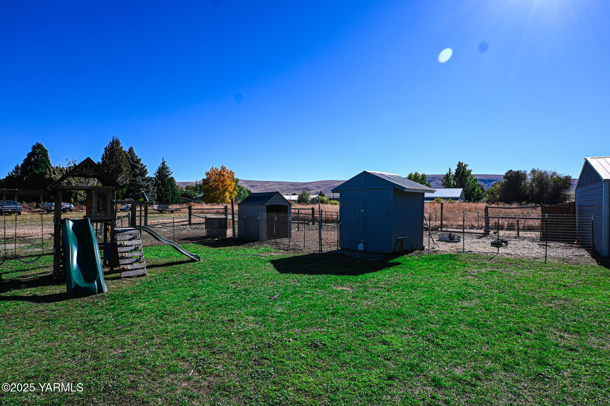 9621 Meadowbrook Road Yakima, WA 98903 - Photo 37 of 41 a view of a house with backyard and sitting area
