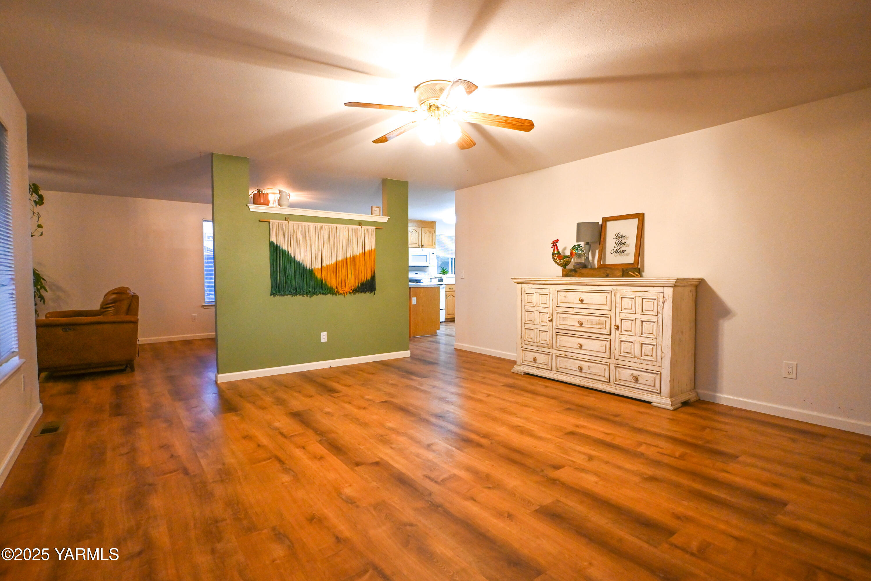 9621 Meadowbrook Road Yakima, WA 98903 - Photo 5 of 41 a view of an empty room with window and wooden floor