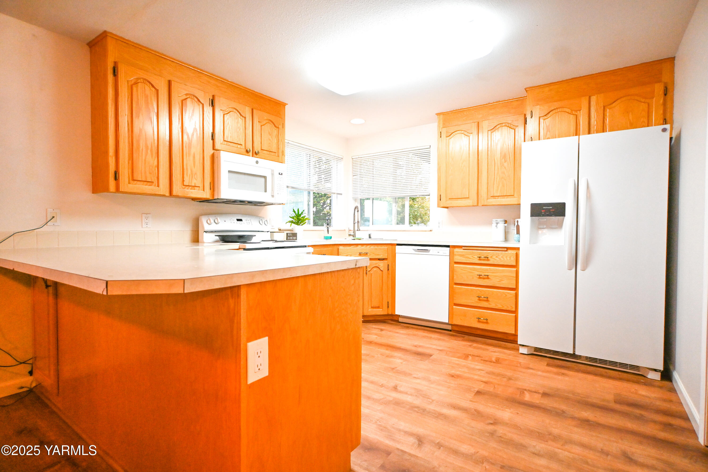 9621 Meadowbrook Road Yakima, WA 98903 - Photo 10 of 41 a kitchen with stainless steel appliances a refrigerator sink and cabinets