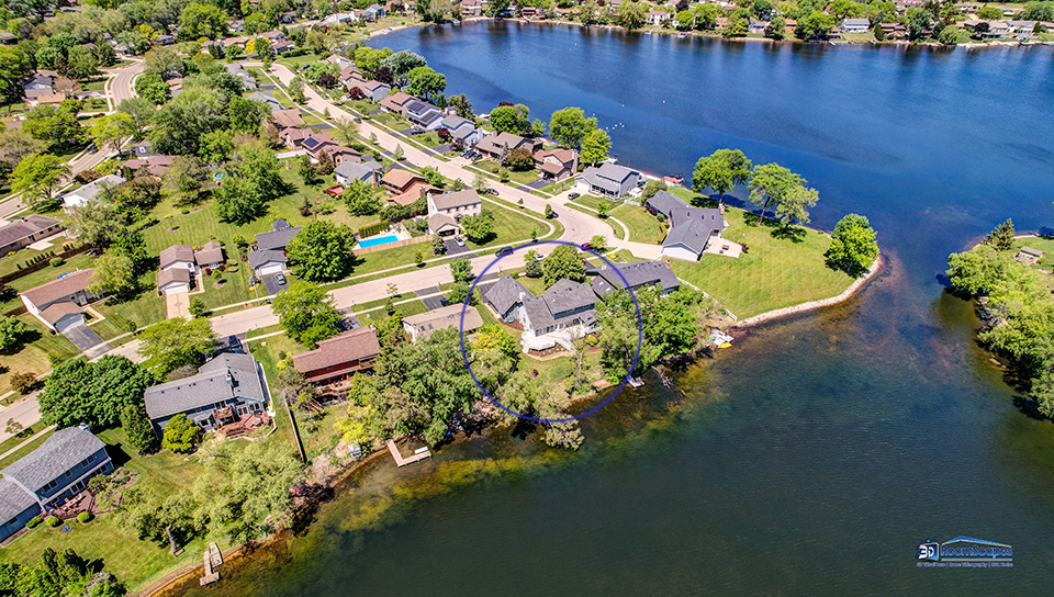2276 High Point Drive Lindenhurst, IL 60046 - Photo 15 of 15 a view of a lake with a house